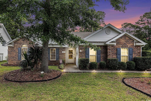 7007 Blade Beak Ln, Myrtle Beach, SC 29588 - view of front of house with brick siding and a lawn