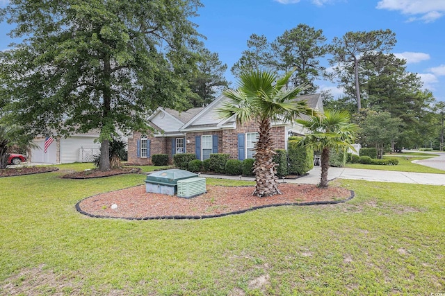 7007 Blade Beak Ln, Myrtle Beach, SC 29588 - view of front of house with a front yard, brick siding, and driveway