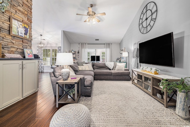 7007 Blade Beak Ln, Myrtle Beach, SC 29588 - living area featuring lofted ceiling, dark wood-style flooring, a ceiling fan, and a chandelier