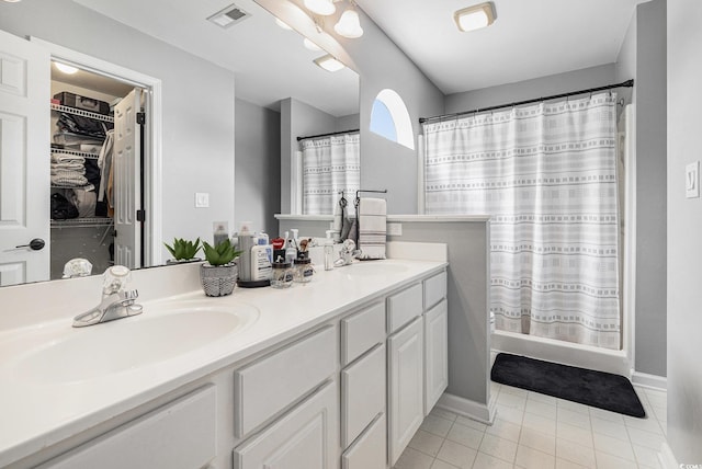7007 Blade Beak Ln, Myrtle Beach, SC 29588 - bathroom with double vanity, tile patterned flooring, a shower with curtain, and baseboards