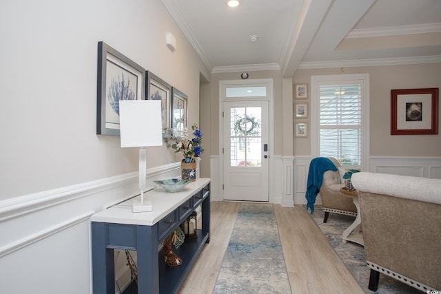 383 Mikita Dr, Surfside Beach, SC 29575 - foyer entrance featuring light wood finished floors, wainscoting, ornamental molding, and a decorative wall
