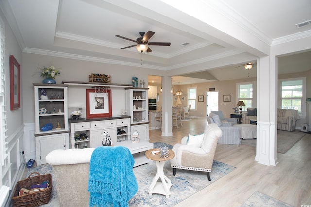 383 Mikita Dr, Surfside Beach, SC 29575 - living area with decorative columns, ceiling fan, light wood-style floors, ornamental molding, and a wainscoted wall