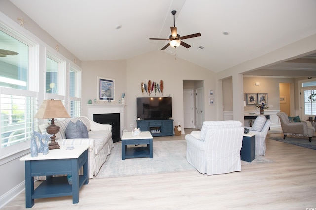 383 Mikita Dr, Surfside Beach, SC 29575 - living room featuring a ceiling fan, light wood-type flooring, lofted ceiling, and a fireplace
