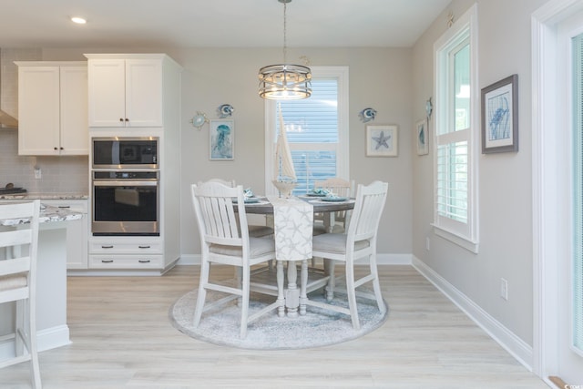 383 Mikita Dr, Surfside Beach, SC 29575 - dining space featuring light wood-style floors, a chandelier, baseboards, and recessed lighting