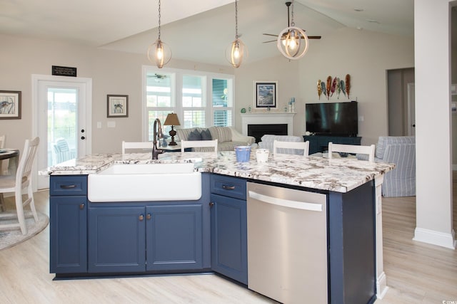 383 Mikita Dr, Surfside Beach, SC 29575 - kitchen with ceiling fan, stainless steel dishwasher, a sink, blue cabinetry, and vaulted ceiling