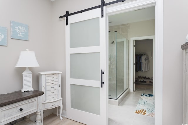 383 Mikita Dr, Surfside Beach, SC 29575 - full bathroom featuring a stall shower, a walk in closet, and tile patterned flooring