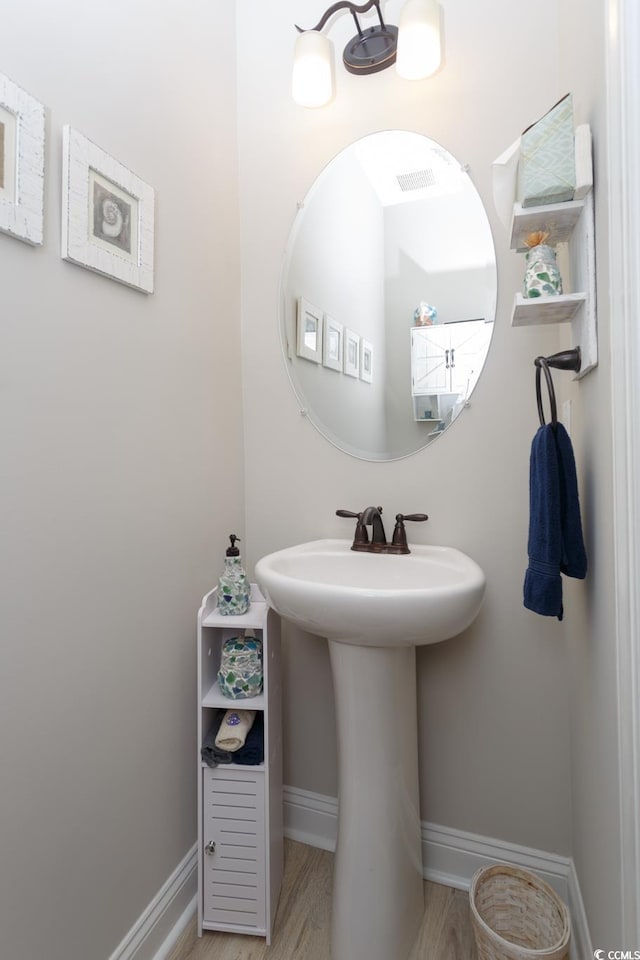 383 Mikita Dr, Surfside Beach, SC 29575 - bathroom featuring baseboards and wood finished floors