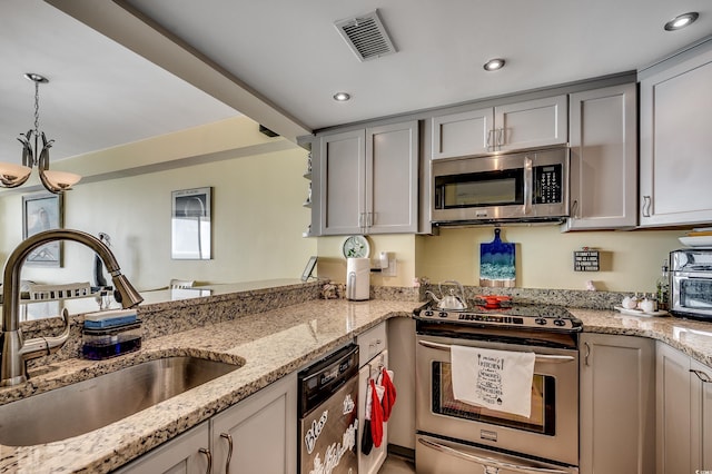 1990 N Waccamaw Dr Unit 1008, Murrells Inlet, SC 29576 - kitchen with appliances with stainless steel finishes, a sink, gray cabinetry, pendant lighting, and recessed lighting