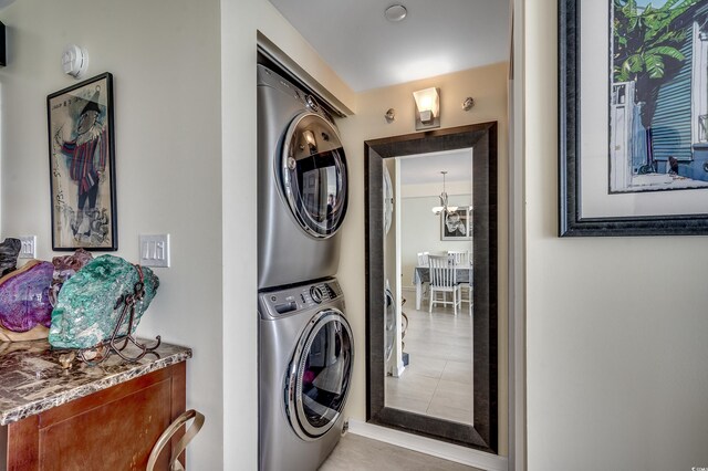 1990 N Waccamaw Dr Unit 1008, Murrells Inlet, SC 29576 - laundry area with stacked washer / drying machine and a chandelier