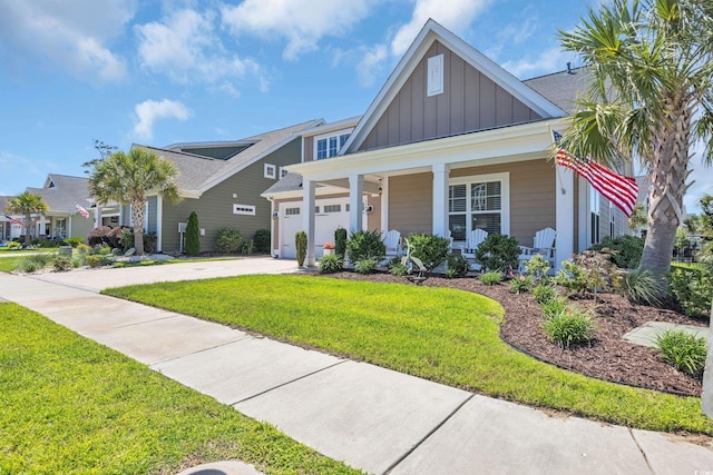 1145 Captain Hooks Way N, Myrtle Beach, SC 29582 - craftsman house with board and batten siding, a porch, concrete driveway, a front lawn, and an attached garage