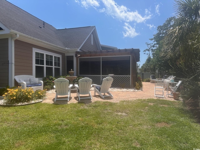 1145 Captain Hooks Way N, Myrtle Beach, SC 29582 - back of property with a shingled roof and a patio
