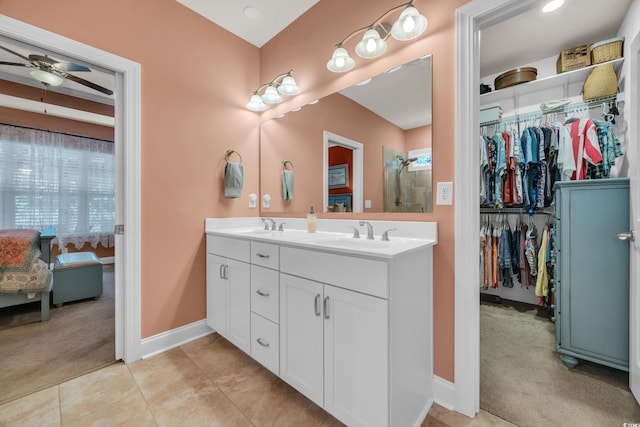 1145 Captain Hooks Way N, Myrtle Beach, SC 29582 - full bath with double vanity, ceiling fan, a spacious closet, and tile patterned floors