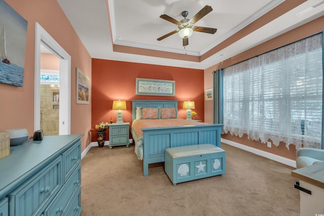 1145 Captain Hooks Way N, Myrtle Beach, SC 29582 - bedroom featuring light carpet, ornamental molding, a ceiling fan, a tray ceiling, and ensuite bathroom