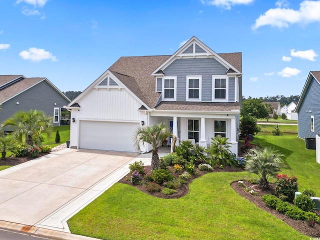 2572 Brescia St, Myrtle Beach, SC 29579 - view of front of home featuring concrete driveway, roof with shingles, a front lawn, an attached garage, and a porch