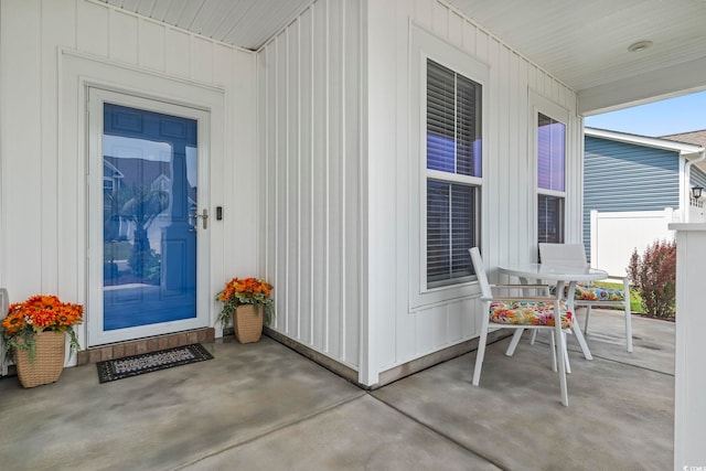 2572 Brescia St, Myrtle Beach, SC 29579 - doorway to property with covered porch and board and batten siding
