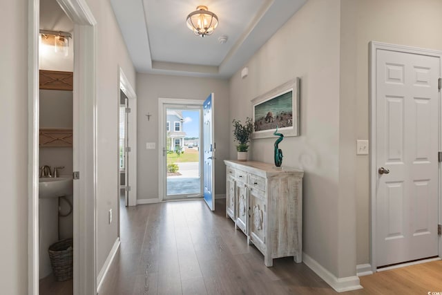 2572 Brescia St, Myrtle Beach, SC 29579 - foyer featuring wood finished floors, baseboards, a chandelier, and a tray ceiling