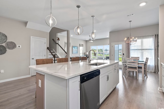 2572 Brescia St, Myrtle Beach, SC 29579 - kitchen featuring dishwasher, a sink, a chandelier, light wood finished floors, and a center island with sink