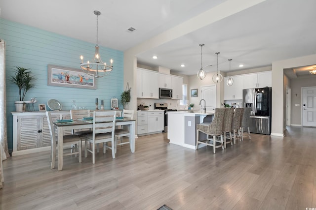 2572 Brescia St, Myrtle Beach, SC 29579 - dining room with a chandelier, light wood-style floors, and recessed lighting