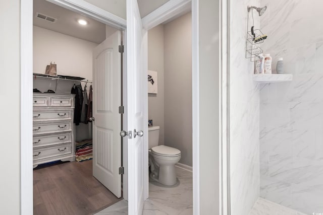 2572 Brescia St, Myrtle Beach, SC 29579 - full bathroom featuring a stall shower, a spacious closet, toilet, and marble look tiles