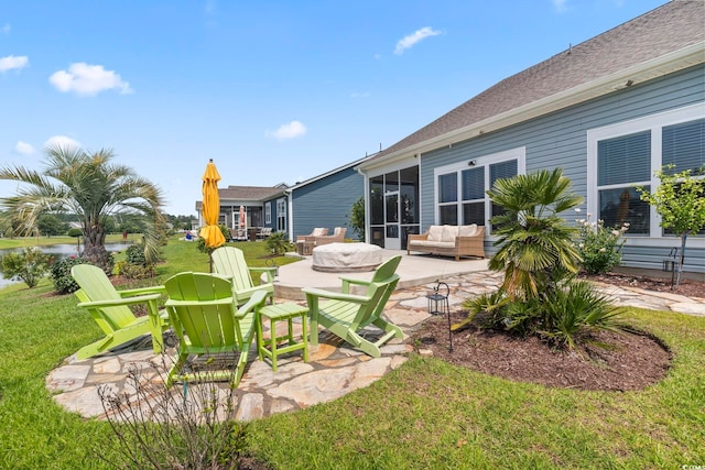 2572 Brescia St, Myrtle Beach, SC 29579 - view of green lawn with a patio area, outdoor lounge area, a sunroom, and a water view