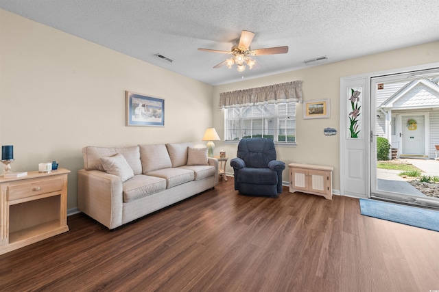 613 S 2nd Ave Unit 21D, North Myrtle Beach, SC 29582 - living area featuring dark wood-type flooring, ceiling fan, and a textured ceiling