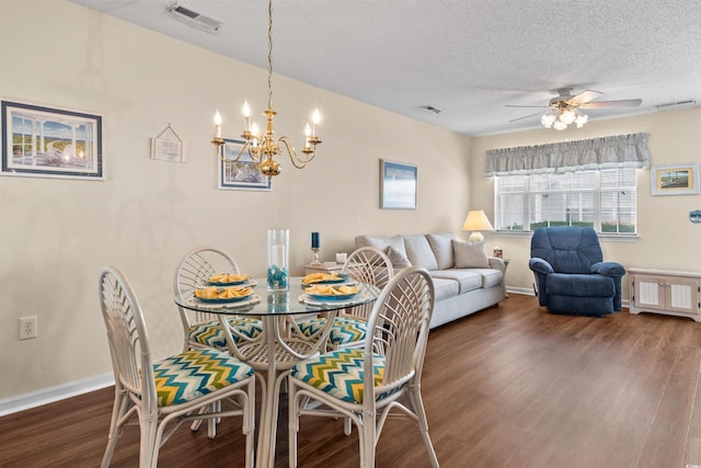 613 S 2nd Ave Unit 21D, North Myrtle Beach, SC 29582 - dining room featuring dark wood-style floors, a ceiling fan, a chandelier, baseboards, and a textured ceiling