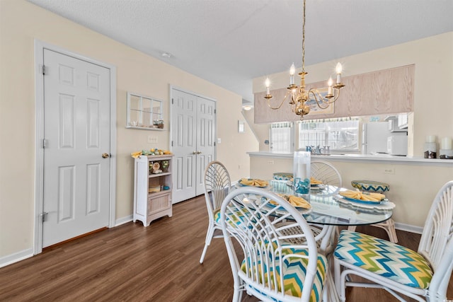 613 S 2nd Ave Unit 21D, North Myrtle Beach, SC 29582 - dining space with wood finished floors, a chandelier, and baseboards
