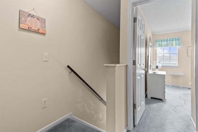 613 S 2nd Ave Unit 21D, North Myrtle Beach, SC 29582 - staircase featuring carpet, a textured ceiling, and baseboards