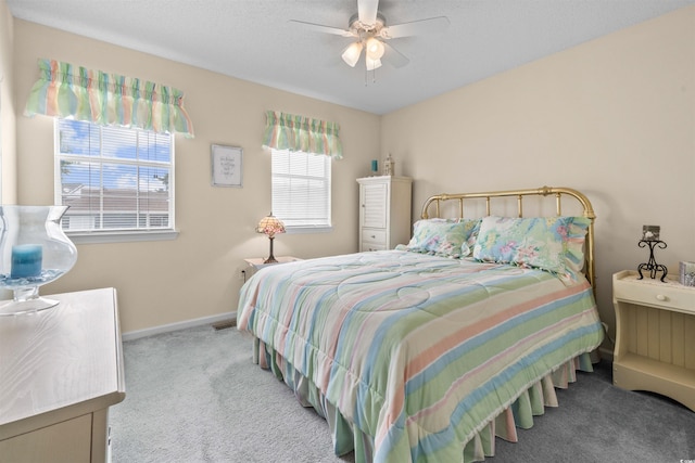 613 S 2nd Ave Unit 21D, North Myrtle Beach, SC 29582 - carpeted bedroom featuring baseboards and a ceiling fan