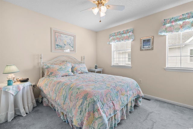 613 S 2nd Ave Unit 21D, North Myrtle Beach, SC 29582 - carpeted bedroom with baseboards and ceiling fan