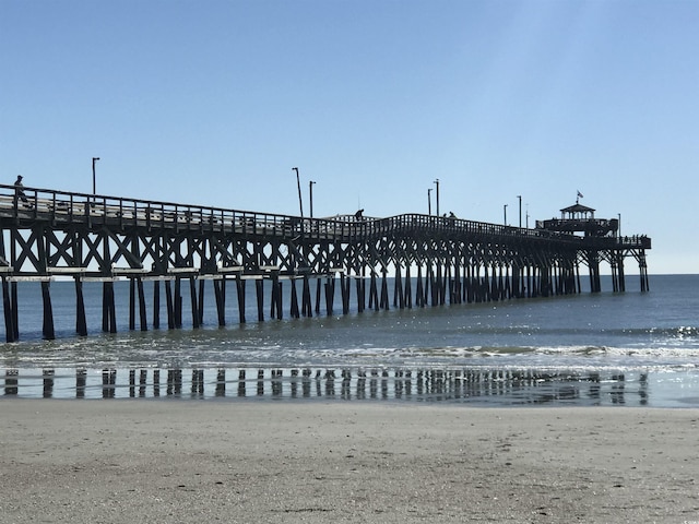 613 S 2nd Ave Unit 21D, North Myrtle Beach, SC 29582 - dock featuring a pier and view of water and beach