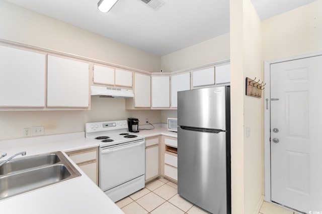1298 River Oaks Dr Unit 5-I, Myrtle Beach, SC 29579 - kitchen with white appliances, under cabinet range hood, a sink, light tile patterned floors, and light countertops