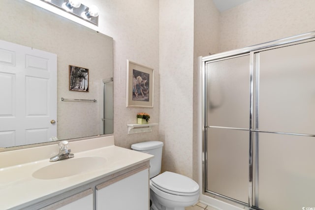 1298 River Oaks Dr Unit 5-I, Myrtle Beach, SC 29579 - bathroom featuring toilet, vanity, a shower with shower door, and tile patterned floors