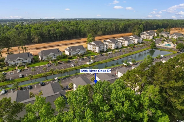 1298 River Oaks Dr Unit 5-I, Myrtle Beach, SC 29579 - aerial overview of property's location featuring a heavily wooded area and nearby suburban area