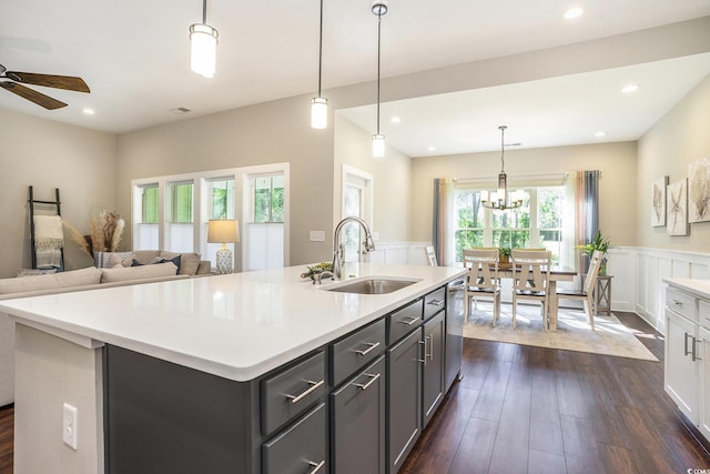 769 Country Club Dr, Pawleys Island, SC 29585 - kitchen featuring a sink, stainless steel dishwasher, dark wood-style floors, ceiling fan, and wainscoting