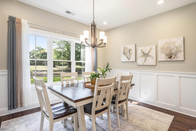 769 Country Club Dr, Pawleys Island, SC 29585 - dining room with a decorative wall, a chandelier, dark wood-type flooring, wainscoting, and recessed lighting
