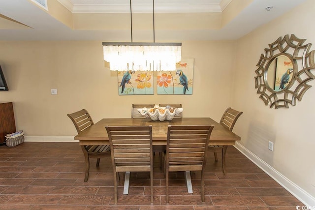 100 N Beach Blvd Unit 1511, North Myrtle Beach, SC 29582 - dining space with a raised ceiling, wood tiled floors, crown molding, and baseboards