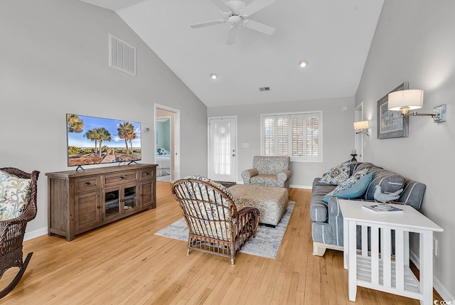 521 Bay Dr, Garden City Beach, SC 29576 - living room with high vaulted ceiling, ceiling fan, and light wood-type flooring