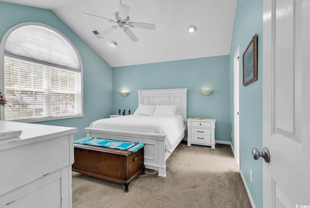521 Bay Dr, Garden City Beach, SC 29576 - bedroom featuring vaulted ceiling, light colored carpet, a ceiling fan, and baseboards