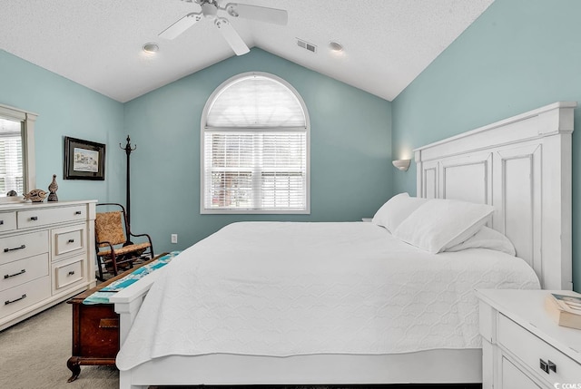 521 Bay Dr, Garden City Beach, SC 29576 - bedroom with light carpet, lofted ceiling, and a ceiling fan