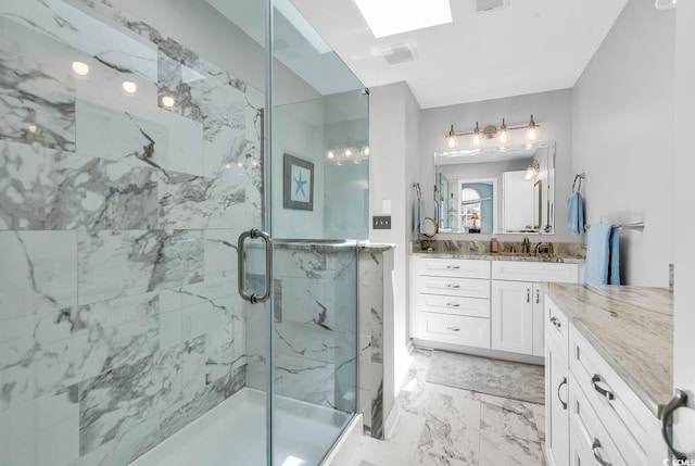 521 Bay Dr, Garden City Beach, SC 29576 - bathroom featuring a marble finish shower, vanity, and marble finish floors
