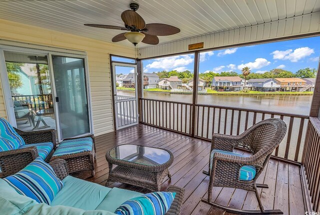 521 Bay Dr, Garden City Beach, SC 29576 - sunroom with a water view, a residential view, and a ceiling fan