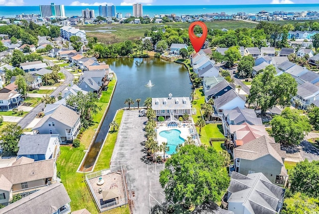 521 Bay Dr, Garden City Beach, SC 29576 - aerial perspective of suburban area featuring a nearby body of water and a pool area