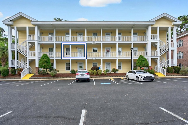 4251 Hibiscus Dr Unit 202, Little River, SC 29566 - view of apartment building / complex with uncovered parking and stairs