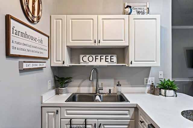 4251 Hibiscus Dr Unit 202, Little River, SC 29566 - kitchen featuring a sink, light countertops, and white cabinetry