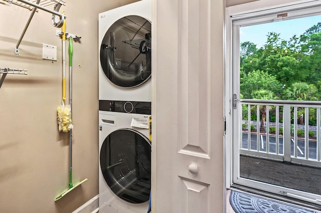 4251 Hibiscus Dr Unit 202, Little River, SC 29566 - laundry room with stacked washing machine and dryer and baseboards