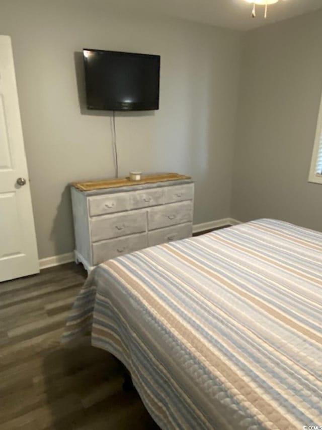 4107 Pinehurst Cir Unit Dd-15, Little River, SC 29566 - bedroom with dark wood-type flooring and baseboards