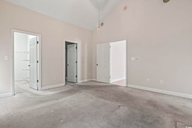 618 5th Ave S, North Myrtle Beach, SC 29582 - unfurnished bedroom with carpet floors, high vaulted ceiling, baseboards, and connected bathroom