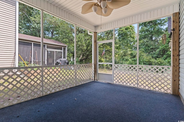 618 5th Ave S, North Myrtle Beach, SC 29582 - unfurnished sunroom with ceiling fan and view of wooded area
