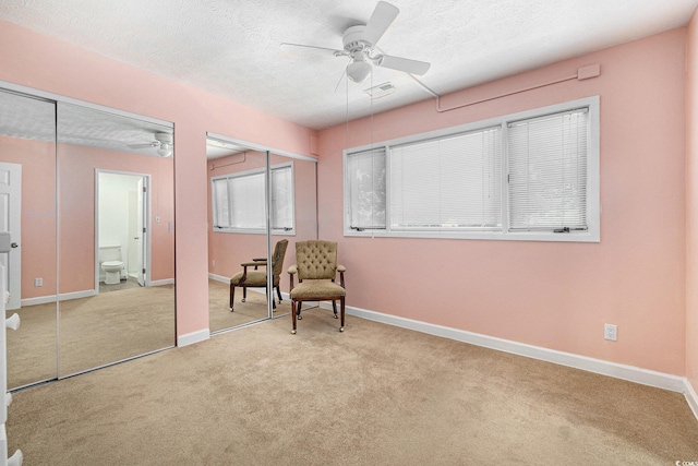 6813 Porcher Dr Unit 1, Myrtle Beach, SC 29572 - sitting room featuring carpet floors, a ceiling fan, a textured ceiling, and baseboards